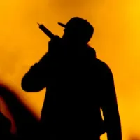 man rapping into a microphone