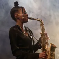 woman playing saxophone