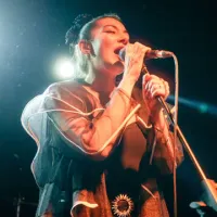 woman singing into a microphone